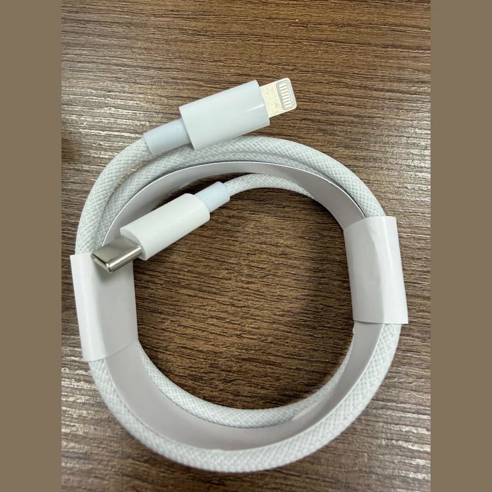 Coiled white MDKG braided USB-C to Lightning cable
